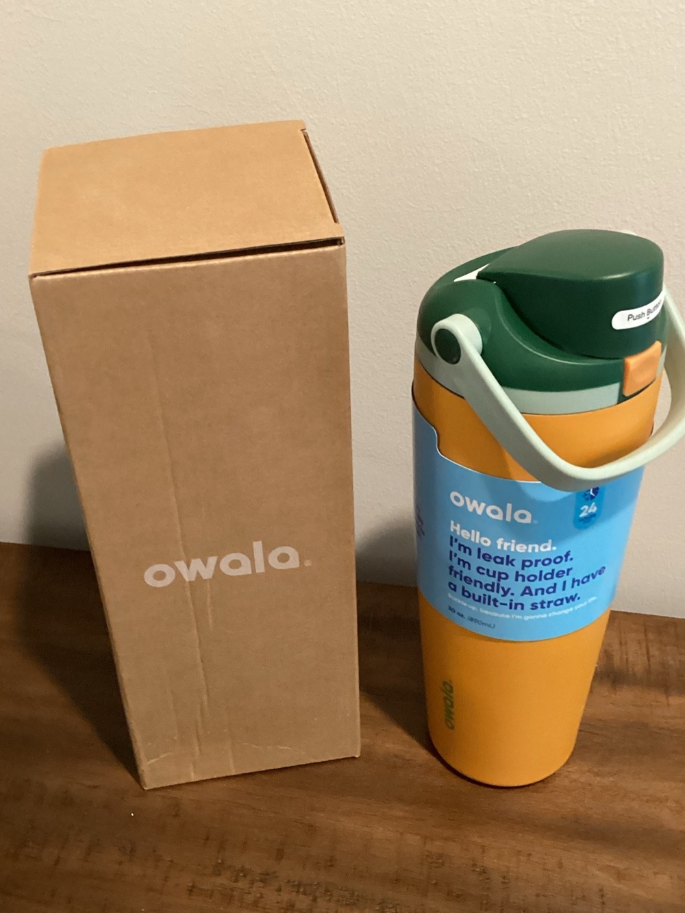Owala 30oz  Insulated Water Bottle with Green Carry Lid and Orange Body